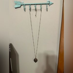 Gold necklace with oval detailed bottom